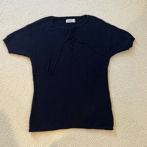 Frame knit lace up top